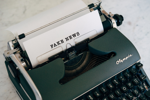 Fake news typewritten on a white sheet of paper